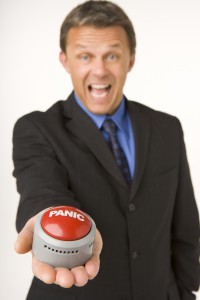 2169207-businessman-holding-a-panic-button